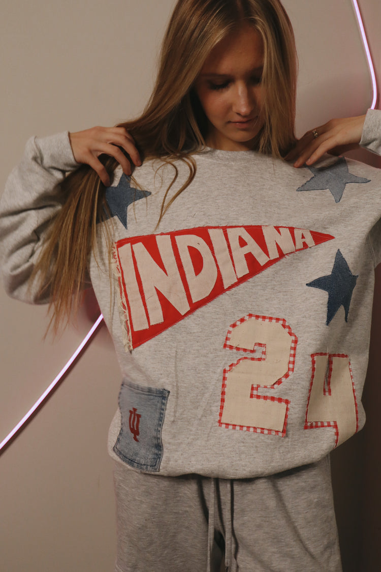 Sweatshirt covered in Call Me Always patches